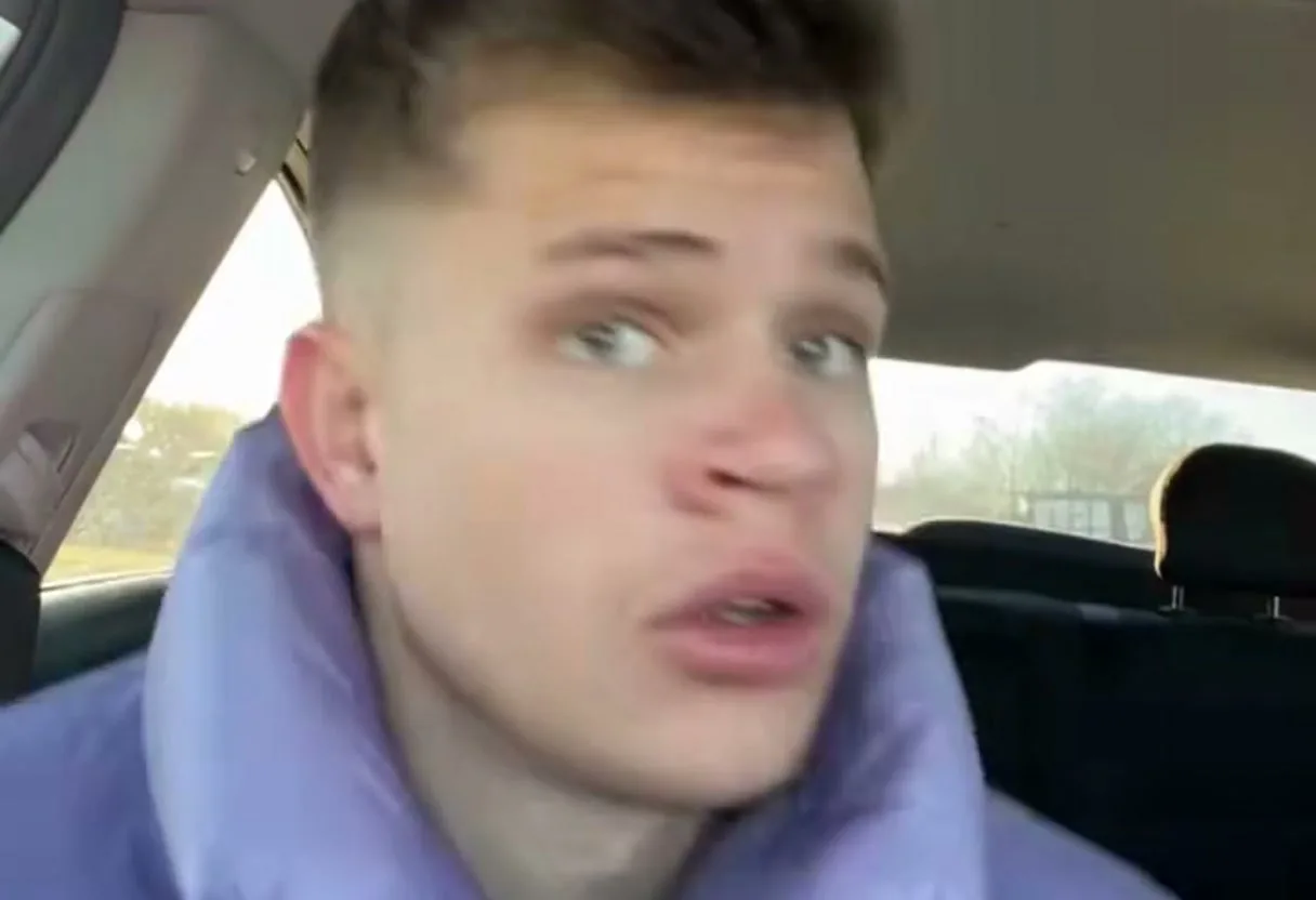 A phone selfie from the front seat of a parked car, the scene every clip is built on